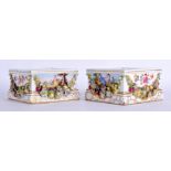 A PAIR OF 19TH CENTURY GERMAN PORCELAIN SQUARE FORM VASE STANDS painted with flowers. 12.5 cm square