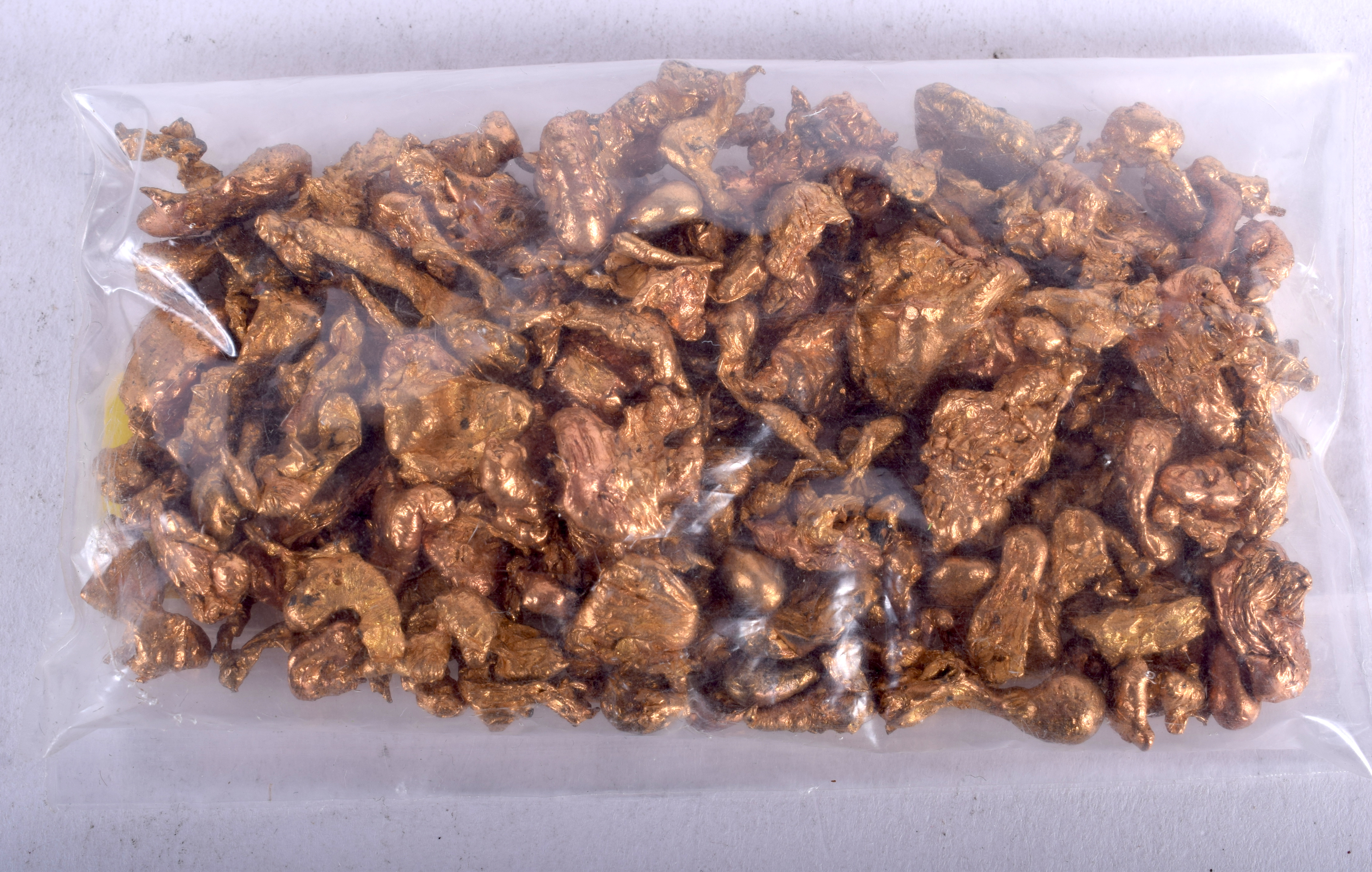 A BAG OF YELLOW METAL NUGGETS. (qty)