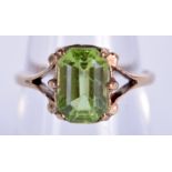 A VINTAGE 9CT GOLD ADD PERIDOT RING. 2.6 grams. N.
