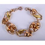 A VINTAGE YELLOW METAL FLOWER BRACELET. 15.5 grams. 17 cm wide.