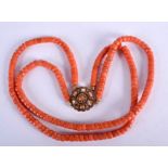 AN 18CT GOLD RED CORAL NECKLACE. 57 grams. Each strand 38 cm long.