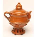 A GLAZED TERRACOTTA JUG AND COVER, 19th century, of tapering cylindrical form with pulled and