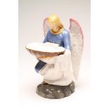 AN ITALIAN DELLA ROBBIA STYLE MAIOLICA ANGEL, late 19th century, modelled kneeling wearing a blue