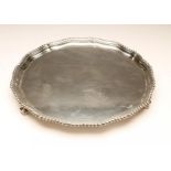 A SILVER SALVER, maker Adie Bros., Birmingham 1935 (Jubilee marks) of shaped circular form with