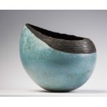 HILARY SIMMS (Contemporary) - A large pale turquoise glazed raku fired stoneware oval vessel from