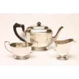 A SILVER THREE PIECE TEA SERVICE, maker's mark S. Ld., Birmingham 1932, of rounded canted oblong