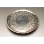 A LATE GEORGE III SILVER SALVER, maker Hannam & Crouch, London 1798, of plain circular form with