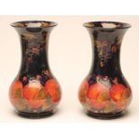 A PAIR OF MOORCROFT POTTERY VASES, c.1916, of baluster form, tubelined and painted with the "