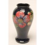 A MOORCROFT POTTERY VASE, post 1950, of inverted baluster form, tubelined and painted with the