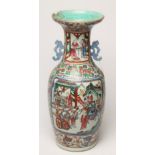 A CANTONESE PORCELAIN VASE of baluster form with open scroll flat handles, painted in famille rose