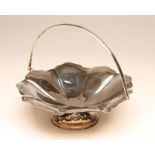 A SILVER CAKE BASKET, maker's mark G.W., Sheffield 1914, of lobed circular form with overhead