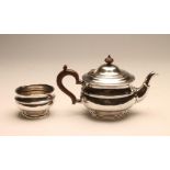 A SILVER TEAPOT AND SUGAR BASIN, maker Robert Stewart, London 1922, of girdled squat globular