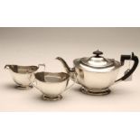 A SILVER THREE PIECE TEA SERVICE, maker Frank Cobb, Sheffield 1935, of canted rounded oblong form on