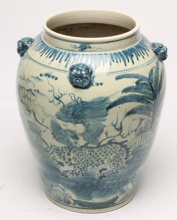 A LARGE CHINESE PROVINCIAL PORCELAIN JAR of ovoid form with four moulded and applied masks to the