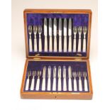 A SET OF TWELVE PAIRS OF SILVER DESSERT KNIVES AND FORKS, maker Allen & Darwin, Sheffield 1913, with