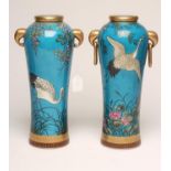 A PAIR OF FRENCH PORCELAIN AESTHETIC VASES, late 19th century, of slender baluster form with two lug