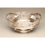 A SILVER FRUIT BOWL, maker Frank Cobb, Sheffield 1930, of lobed circular form with six scrolling