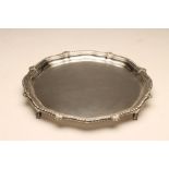 A SILVER SALVER, maker Charles Bradbury, Sheffield 1942, of shaped circular form, the gadrooned