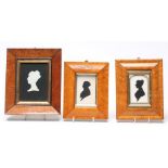 A VICTORIAN SILHOUETTE BUST PORTRAIT OF A LADY, profile to sinister, white paper on black, unsigned,