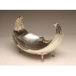 A SILVER FRUIT DISH, maker Manoah Rhodes, Sheffield probably 1930, of boat form with high scroll