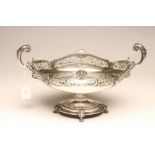 A SILVER TABLE CENTREPIECE, maker Manoah Rhodes, London 1924, of boat form, the cast and applied