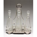 AN EDWARDIAN EPNS TRIPLE DECANTER STAND, maker Mappin & Webb, the central square platform flanked by