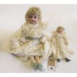 An Armand Marseille bisque head and shoulders doll, with brown sleeping glass eyes, open mouth and