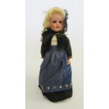 A Seyfarth and Reinhardt bisque head doll with brown glass sleeping eyes, open mouth and teeth,