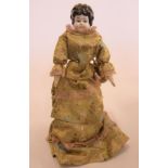 A china shoulder head doll with painted face and hair, stuffed fabric body, composition hands,