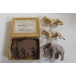 Eleven card silhouettes of wild animals by Charles & Son, boxed, and three velvet covered animals,