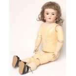 A Heinrich Handwerck bisque head doll with brown glass sleeping eyes, open mouth and teeth,