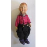 A German, probably Bing, boy doll with painted composition head, stuffed fabric body in felt and