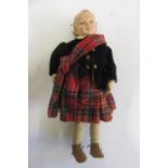 An Albert Schoenhut all wood boy doll with carved painted face and hair, jointed limbs and body,