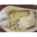 A quantity of dolls clothing in crochet, cotton and wool, and other accessories (Est. plus 21%