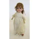 An Armand Marseille Floradora bisque head doll with blue glass sleeping eyes, open mouth and