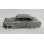 A Cadillac saloon car, Japanese, tinplate, c.1955, in grey, 11" long (Est. plus 21% premium inc.