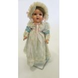 A German all composition doll, possibly Kley & Hahn, with blue glass sleeping eyes, open mouth and
