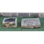 A SANDSTONE TROUGH of shallow oblong form, 24" x 17" x 6 1/2", together with another, well cut,