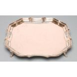 A SILVER SALVER, maker Barker Bros., Chester 1919, of square form with pie-crust rim, raised upon