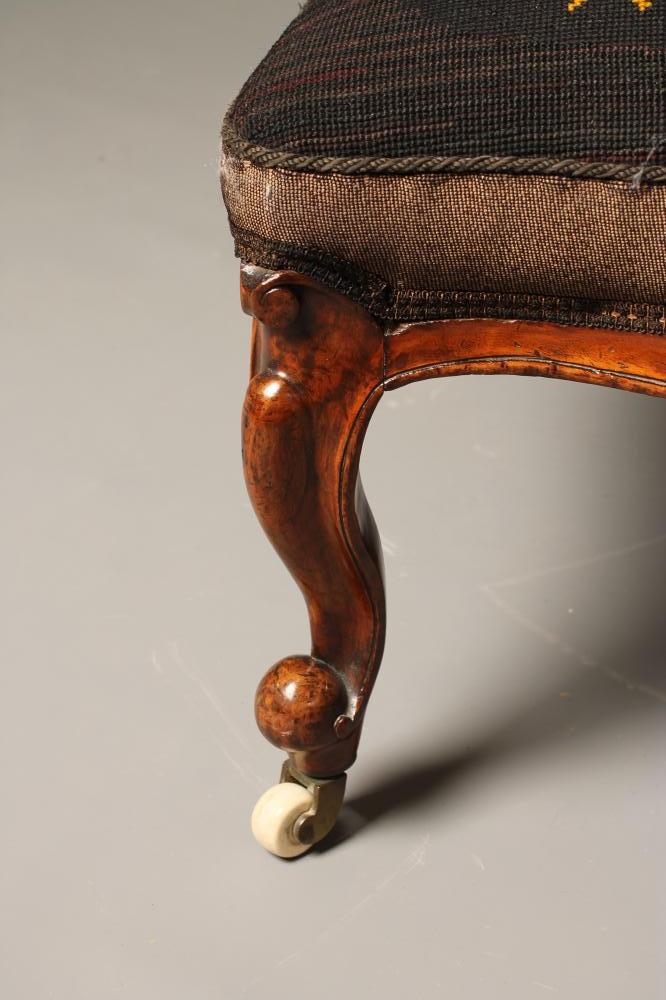 A VICTORIAN WALNUT FRAMED NURSING CHAIR of spoon back form upholstered in gros point with flowers on - Image 2 of 3