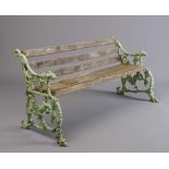 A VICTORIAN CAST IRON SEAT in squirrel and grape pattern with slatted hard wood seat and back, 62" x