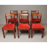 A SET OF SIX EARLY VICTORIAN MAHOGANY DINING CHAIRS, the scroll back uprights enclosing a panelled