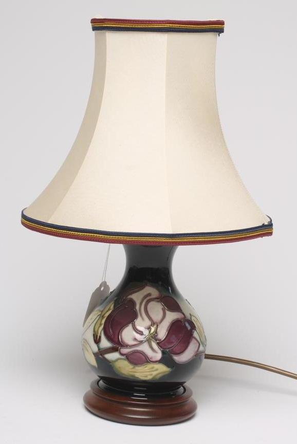 A MOORCROFT POTTERY TABLE LAMP BASE, modern, of squat baluster form, tubelined and painted in sombre