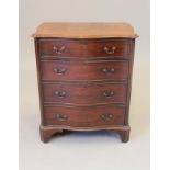 A SMALL GEORGIAN DESIGN MAHOGANY CHEST, early 20th century, of serpentine outline, the moulded edged