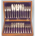 A SET OF TWELVE PAIRS OF SILVER FISH KNIVES AND FORKS, maker's mark HW, Sheffield 1915, with