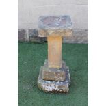 A SANDSTONE BIRD BATH of square form, on stepped base, 12" x 27 1/2" (Est. plus 21% premium inc.