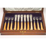 A SET OF SIX LATE VICTORIAN SILVER FRUIT KNIVES AND FORKS, maker Mappin Bros., Sheffield 1897, the