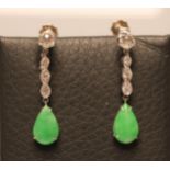 A PAIR OF ART DECO DROP EARRINGS, the tear polished jade panels claw set and pendant from a rope