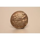 A TETRADRACHM in the name of Alexander the Great, head of Herakles/Zeus seated, posthumous issue,