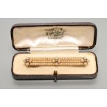 A VICTORIAN SEED PEARL TRIPLE BAR BROOCH, with three applied pearl clusters each centred by a rose
